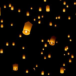 Hot air lanterns in the sky at yee peng festival Chiang Mai Thailand