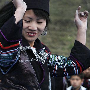 Monday Indigo Blues -- Hmong dancer over clapping Bamboo