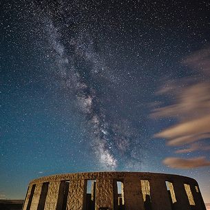 Moonlit Stonehenge under Milky way