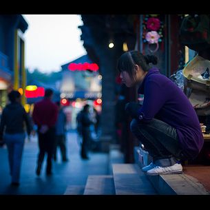 Shopkeeper in Beijing on Steps