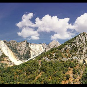 Travelling along winding and steep roads of the marble mountains